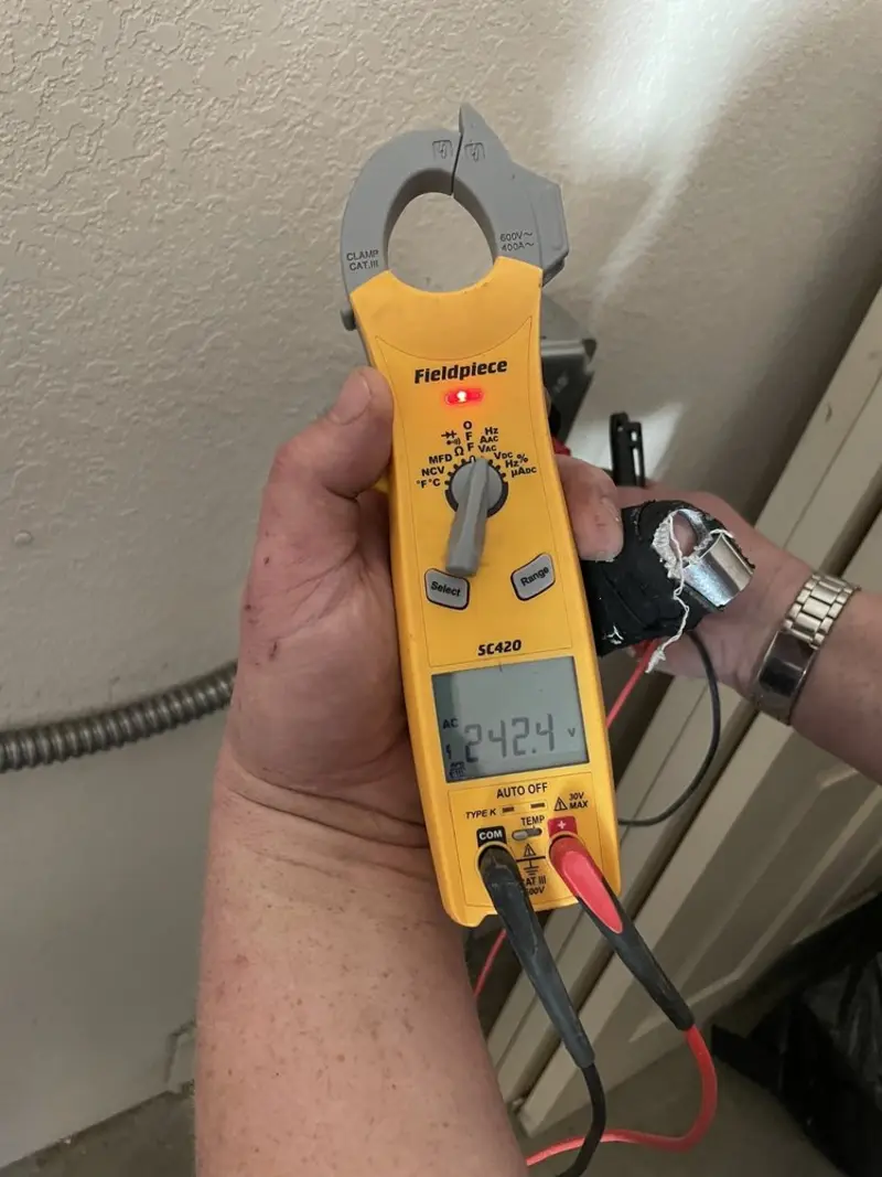 Voltage testing with clamp meter during Recessed Lighting Installation in Milton-Freewater